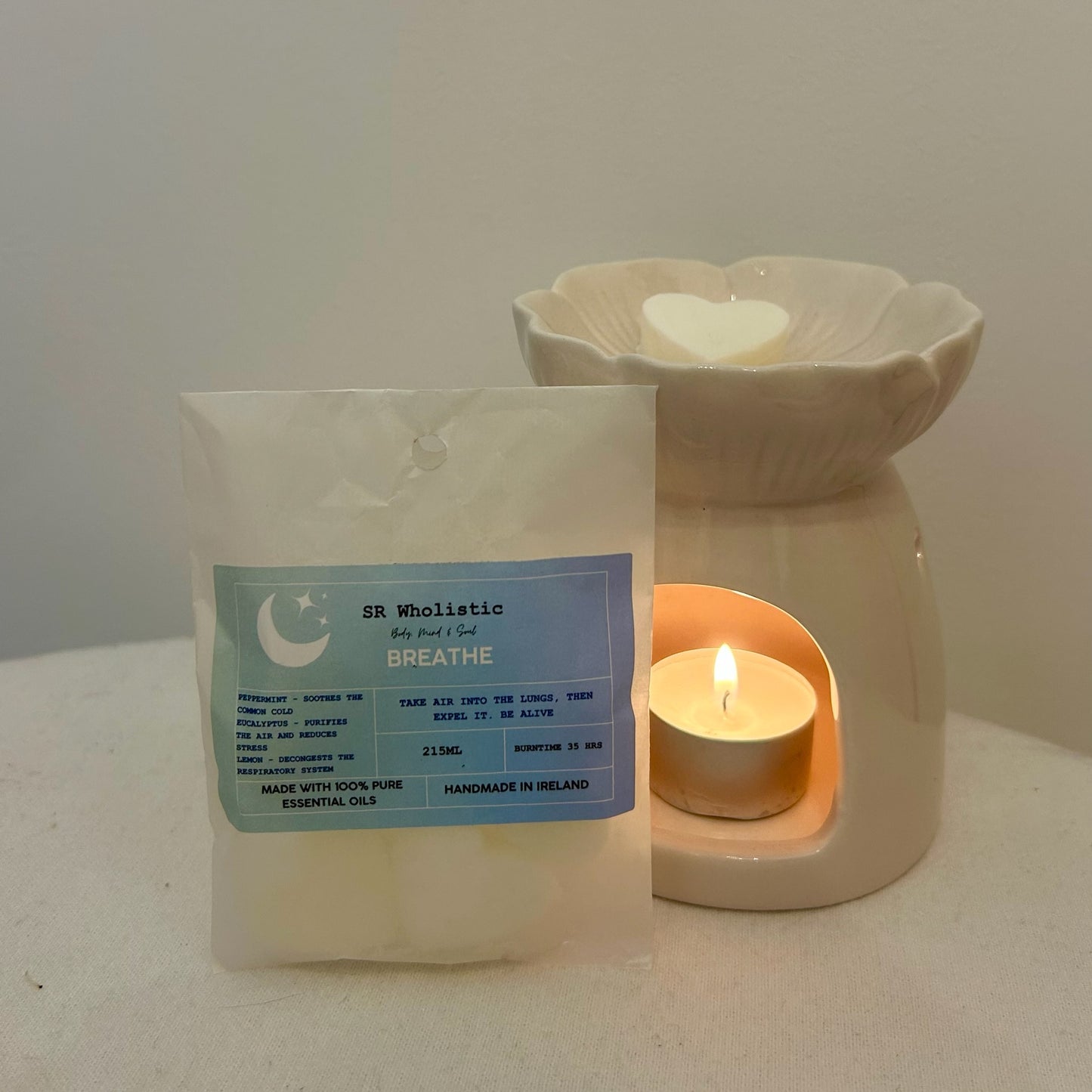“Breathe Wax Melts gently melting in a wax burner, releasing a crisp and refreshing aroma of peppermint, eucalyptus and lemon.”
