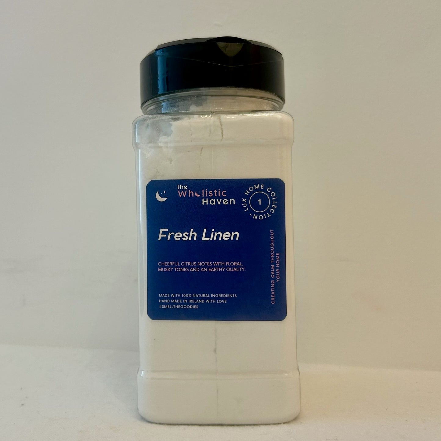 The Wholistic Haven Luxury Fresh Linen Carpet Freshener 350g pack standing alone on a white background.