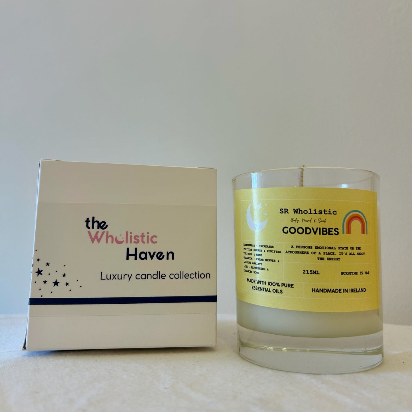 "Goodvibes candle placed beside its branded packaging box on a clean, serene surface."