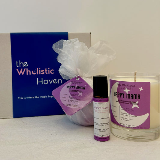 "Happy Mama Pregnancy Gift Set displayed beside a soft, calming gift box, featuring a soothing trio of candle, bath bomb, and rollerball infused with lavender, ginger, and bergamot – crafted for expectant mums."