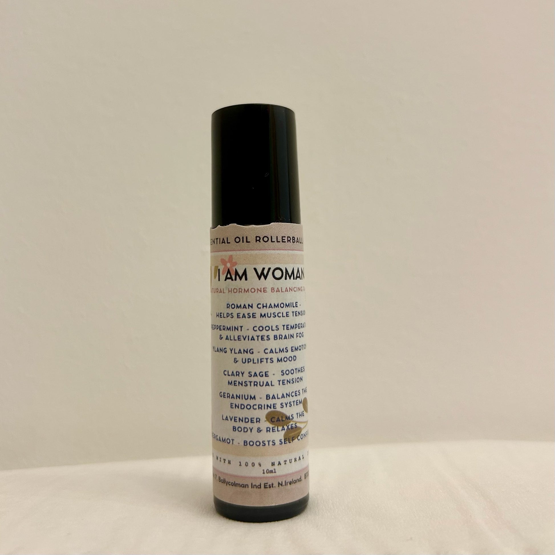 “I am grounded. I am woman.” I am woman essential oil menopause support rollerball blend - ylang ylang, roman chamomile, lavender, bergamot, geranium, peppermint, clary sage