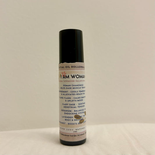 “I am grounded. I am woman.” I am woman essential oil menopause support rollerball blend - ylang ylang, roman chamomile, lavender, bergamot, geranium, peppermint, clary sage