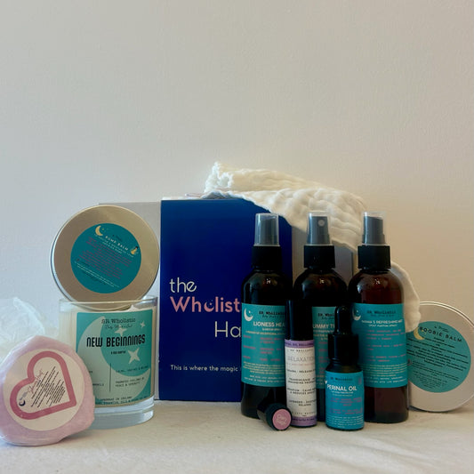 "Wholistic Haven Pregnancy Gift Set flat lay featuring New Beginnings candle, Lioness Heart labour spray, Tummy Tightener, Mama's Refreshing Mist, Bump Balm, Boobie Balm, clary sage sample, muslin cloth, and aromatherapy shower bomb – all made with natural, pregnancy-safe ingredients."