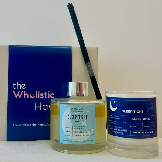 Sleep Tight candle and diffuser on a nightstand with dim lighting