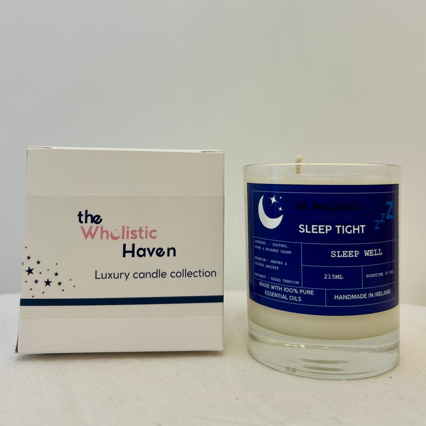 "Sleep Tight candle positioned beside its branded packaging box on a clean, calming surface."