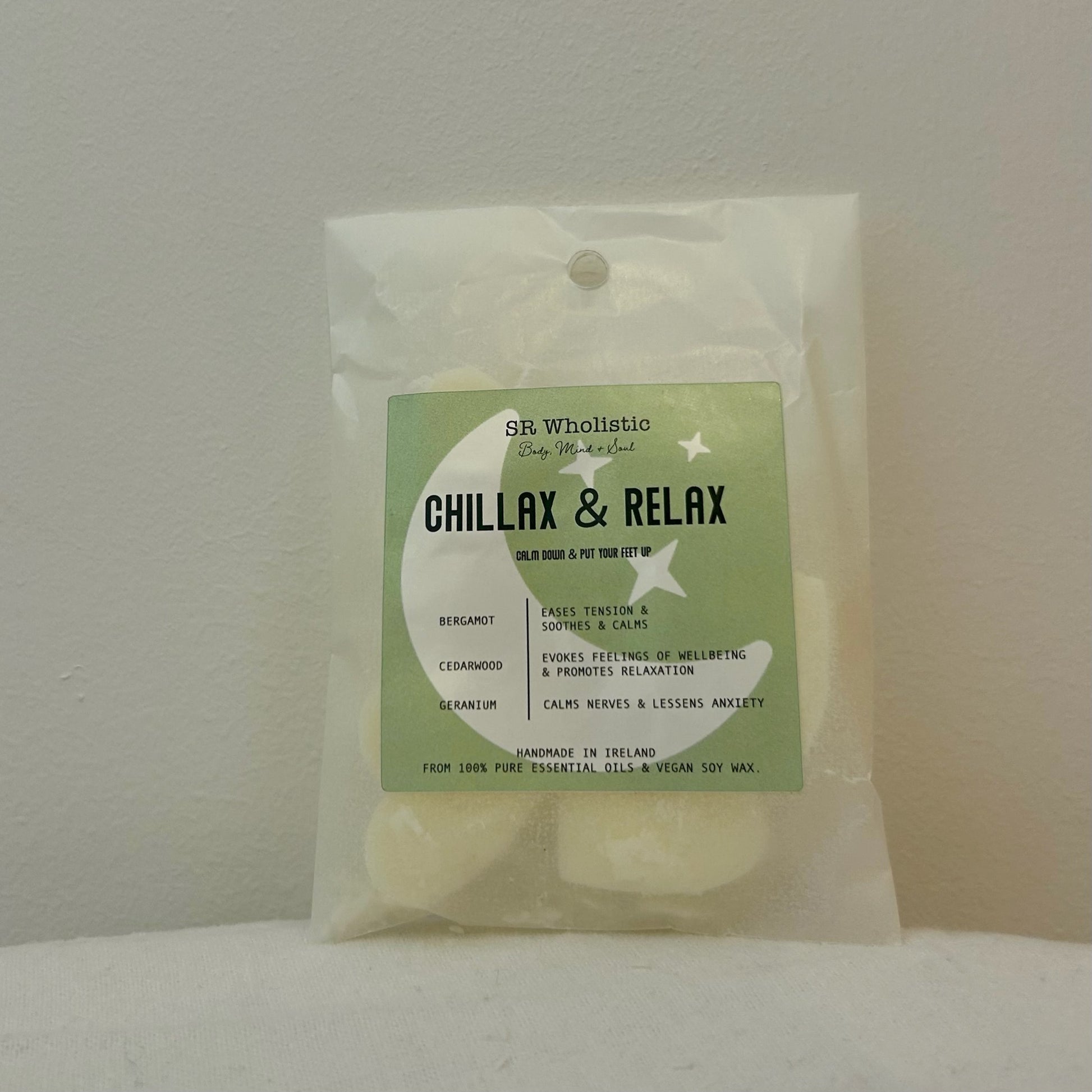 “Chillax & Relax Wax Melts – Cedarwood, Geranium & Bergamot blend in eco-friendly packaging with heart-shaped melts visible inside.”
