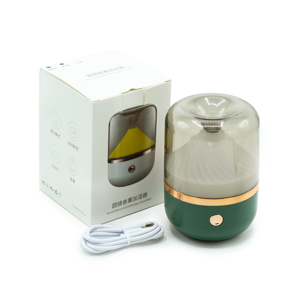 Green humidifier with packaging and USB cable on a white background