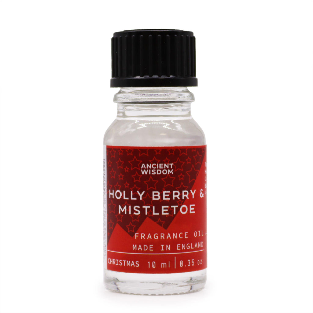Small glass bottle with a red label featuring 'Holly Berry & Mistletoe' on a white background.