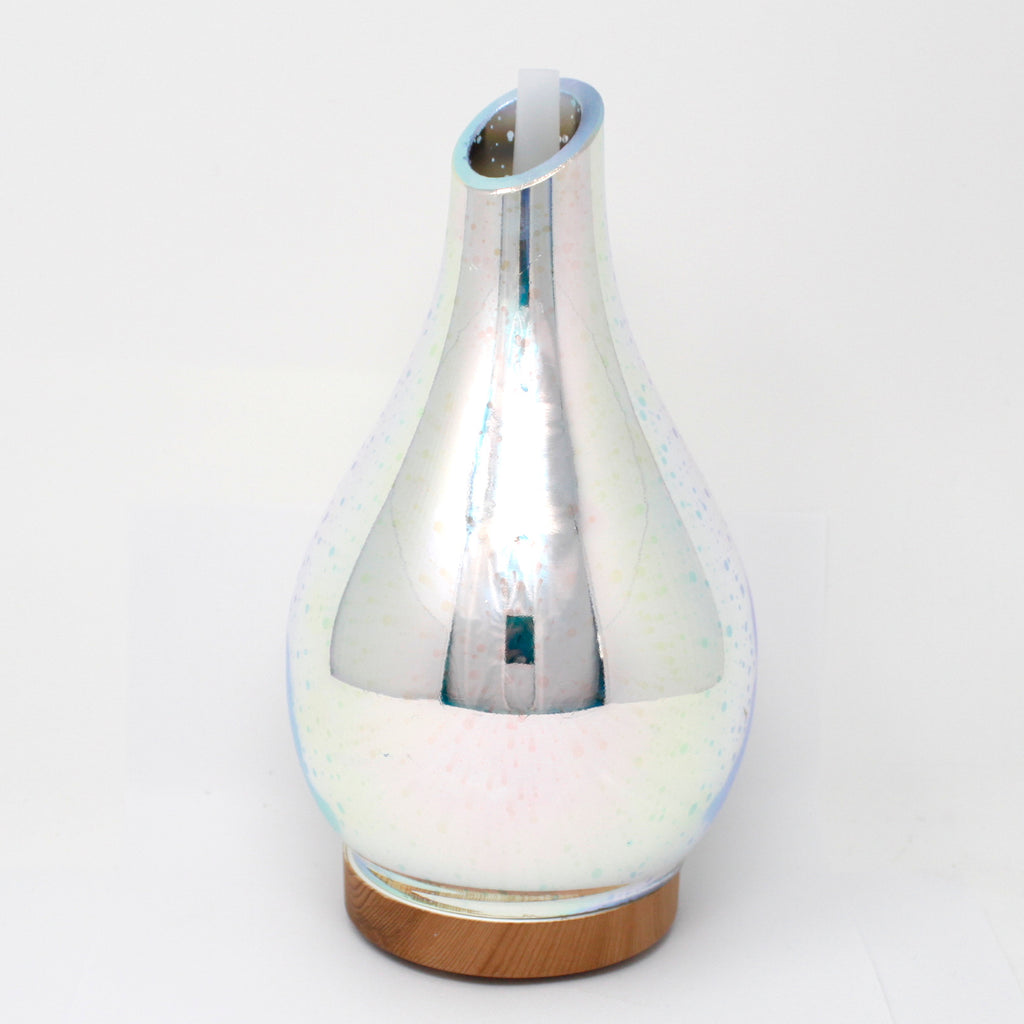 Silver iridescent vase with wooden base on a white background