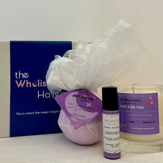 "Just For You Gift Set displayed beside its elegant gift box, featuring a relaxing trio of candle, bath bomb, and rollerball infused with jasmine and lavender essential oils."