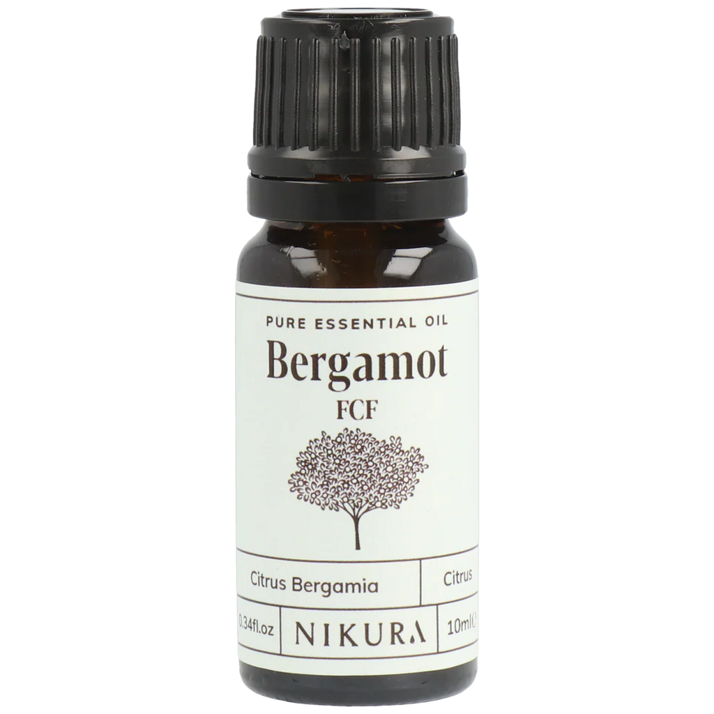 Bergamot essential oil bottle with black cap on a white background