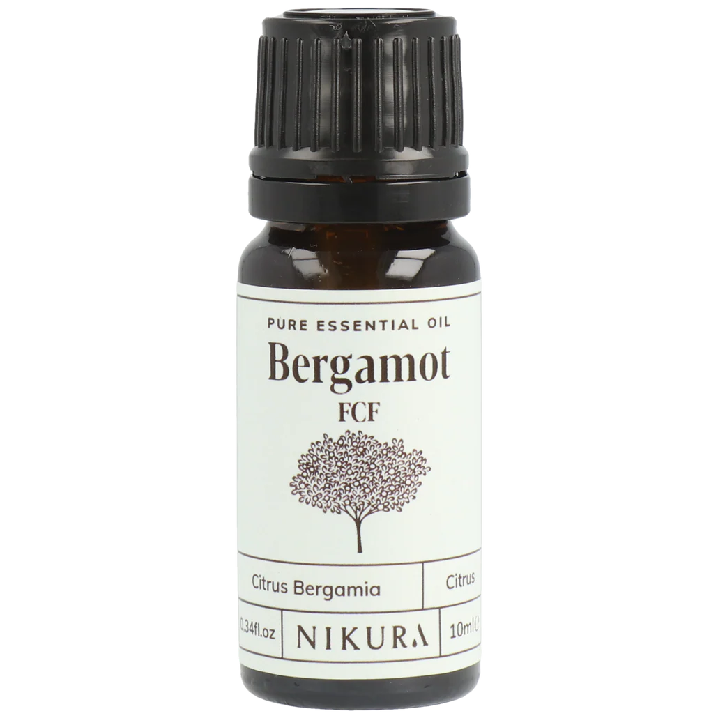 Bergamot essential oil bottle with black cap on a white background