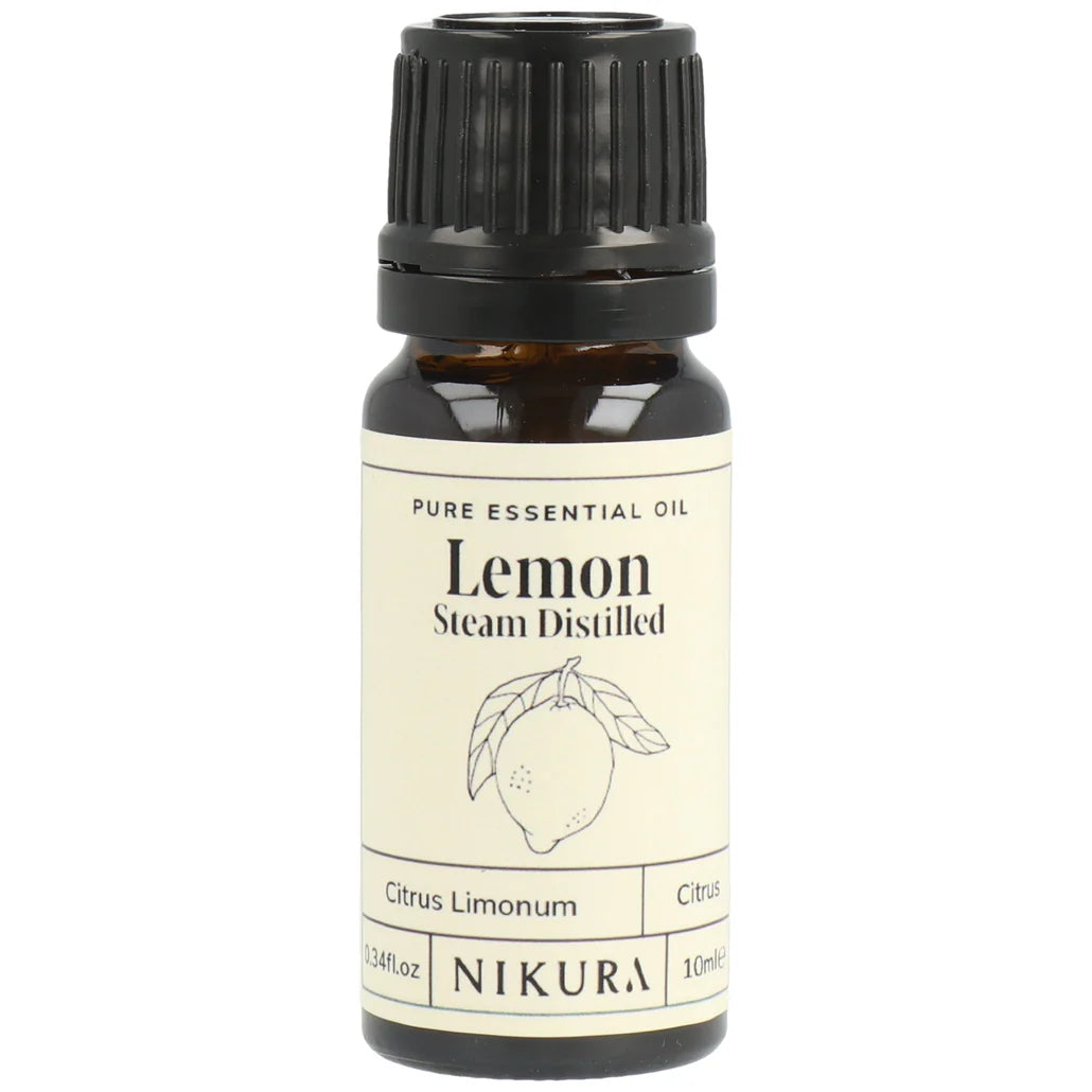 Nikura lemon essential oil bottle on a white background