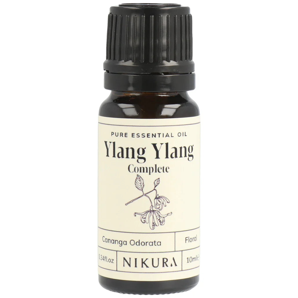 Nikura Ylang Ylang essential oil bottle on a white background