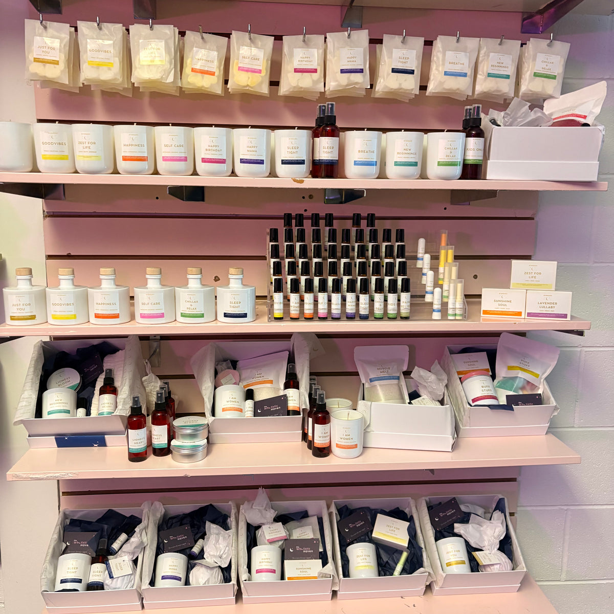 Shelves with various aromatherapy products in a store setting