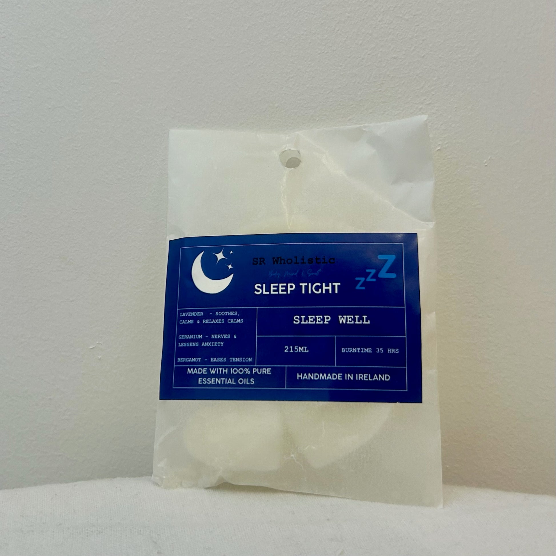 “Sleep Tight Wax Melts – Bergamot, Lavender & Geranium blend in eco-friendly packaging with heart-shaped melts visible through the front.”