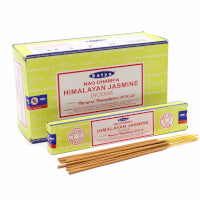 Two boxes of 'Himalayan Jasmine' incense with sticks on a white background
