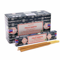 Boxes of Palo Santo incense with sticks on a white background